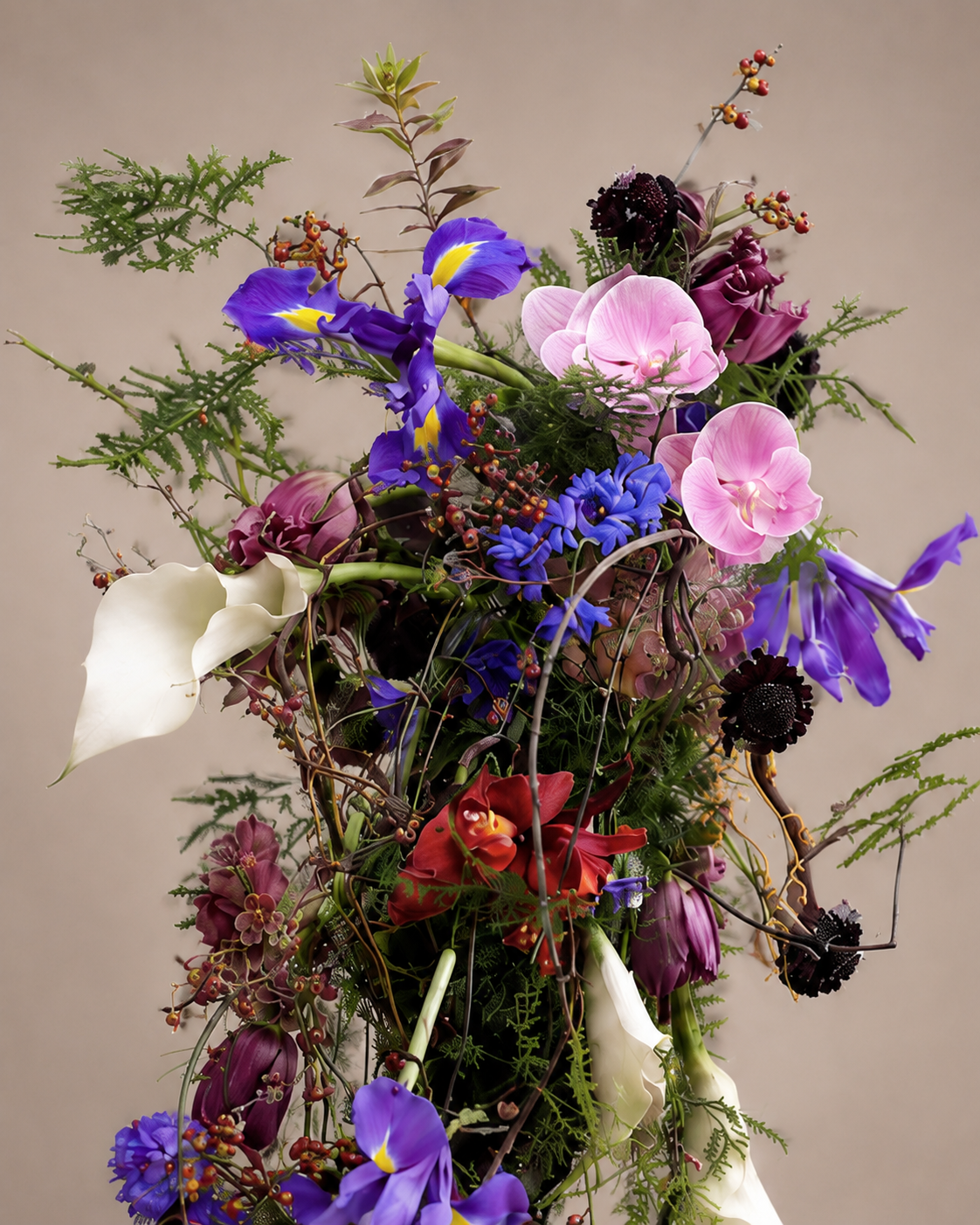 Close-up detail of iris, pink orchid, and calla lily at the top of the Botanical Couture cascade