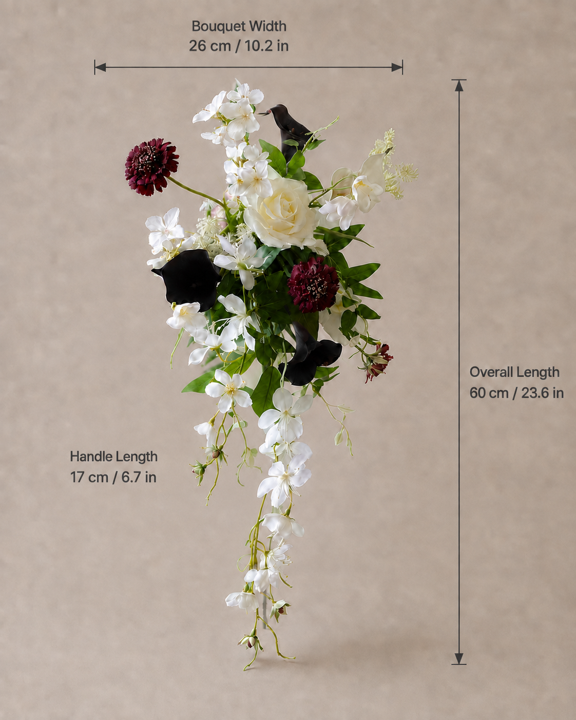 Close-up of a bride in a draped V-neck ivory gown holding the Ivory Noir bouquet against her waist, featuring ivory rose, plum calla lily and burgundy scabiosa blooms